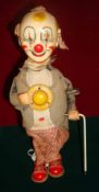 1950s Clockwork Tin Plate Clown: Japanese made having tin plate Head, Wire Legs and Shoes and