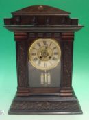 20th Century Wooden Mantel Clock: Heavy carved base having roman numerals within a gilt surround,