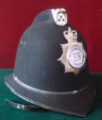 Metropolitan Police Helmet: High comb Helmet 1987 complete with liner and chin strap having chrome