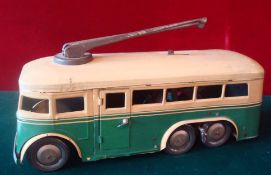 1950s Tin Plate Clockwork Bus: French 6 wheeler Trolley Bus with metal guides to roof having opening