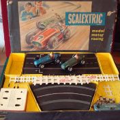 Early Scalextric Motor Racing set: Comprising tinplate Racing Cars, one is dark green with racing