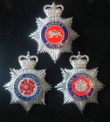 Selection of Queens Crown Police Helmet Plates: To consist of West Yorkshire Police, Surrey