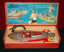 Schuco No.5411 Delfino battery operated Speed Boat: Plastic bodied model with red hull, silver