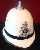 Isle of Man White Police Helmet: Hard plastic helmet having chrome badge to front and ball top