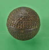 A small Alling bramble gutty golf ball c1890 - with concentric circles to each pole and the