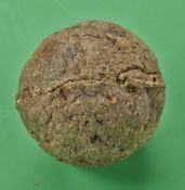 A rare small smooth gutty golf ball c1850 – used with minor cracks and strike marks, reputedly