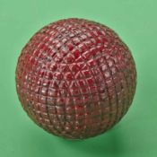 Scarce red painted square patterned gutty golf ball, c1880 – retaining good shape, one strike mark