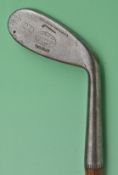 An interesting Tom Stewart made cleek featuring an unusual elongated oval shaped head, stamped