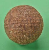 An unnamed red mesh patent gutty golf ball c1880 – well used, hence general wear and oxidized