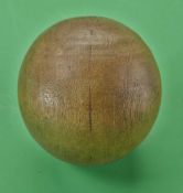 An early and interesting small light stained wooden ball, possibly from the 1800s – retaining good