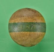 A small wooden ball with a green strip to the circumference c1890 – no visible marks