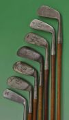 Composed set of 7x Tom Stewart made irons and putter for various club makers to incl long irons to