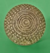 A large Alling bramble rubber core golf ball c1910 - with concentric circles to each pole and the