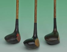 3x dark stained socket head woods to incl a driver, a driver/brassie c/w red fibre face insert and