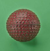 An interesting and early small unnamed red bramble patterned golf ball c1890 - retaining good shape,