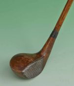 Interesting Tom Bendelow small curved sole socket head brassie - fitted with a deep lined steel face