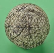 A unique Whitman & Barnes diamond pattern gutty golf ball c1900 – well used with several strike