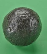 An interesting large smooth gutta percha golf ball c1850 devoid of paint and well used with