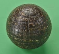 An early Tom Morris style uneven hand hammered gutty golf ball c1860’s - retaining a good shape