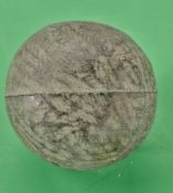 An interesting small gutty golf ball – with random cover marks