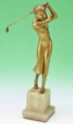 1930s bronzed metal figure of a lady golfer - mounted on a square onyx base; overall 11.5”h