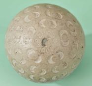 An Arch Colonel half-moon dimple rubber core golf ball c1912 - made by St Mungo MFG Co., retaining