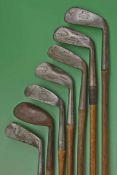 Composed set of 7x Tom Stewart made irons for various club makers to incl 2 iron, mid iron,