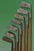 Composed set of 7x Tom Stewart made irons and putter for various club makers to incl driving iron to