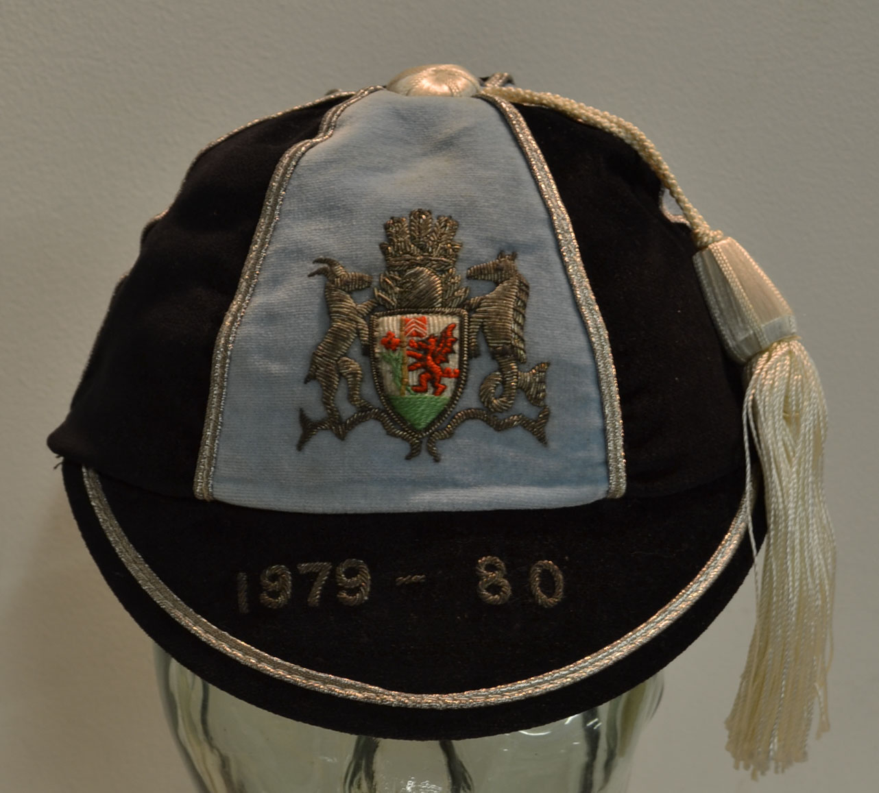 1979/80 Cardiff RFC Rugby cap – blue and black segments with crest, silver braid trim and tassel, no