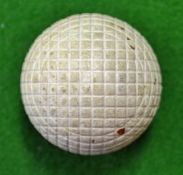 Unnamed moulded mesh guttie golf ball c1880s – retaining all of the original white paint and appears