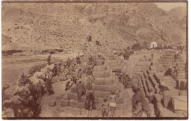 India pre-WW1 – Sikhs with supplies in the NWF / Tirah Campaign. Fine photographic postcard of