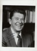 Autograph – Ronald Reagan US President bw 10x8 showing Reagan hs smiling to his left inscribed to