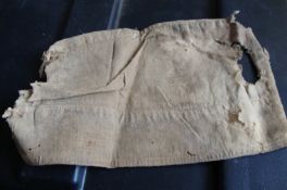 Gandhi a linen cap^ with areas of damage^ which belonged to Gandhi and which was worn by him
