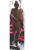 Gandhi a finely carved full length figure of Gandhi in wood^ showing him in typical pose with his