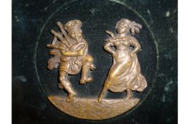 Jacobites bronze plaque^ probably late 18th c^ showing a Scottish highland couple^ both dressed in