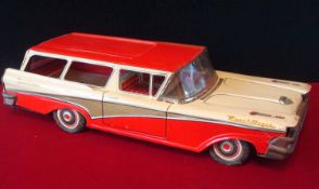 Large Scale Tin Plate US Ranch Wagon: Friction Powered Red and Cream with opening tailgate Made by