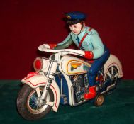 Japanese TM Toys Police Motorcycle and Policeman: Large tin plate functional toy, moves along the