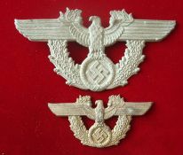 WW2 German Badges: Two large German Eagle Badges having spread winged Eagle with Swastika below