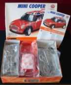 Burago 1/18 Mini Cooper Metal Kit: 2001 Mini metal kit with painted metal body in Red, un-made in