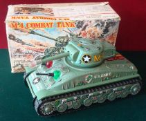 Taiyo (Japan) M4 Combat Tank: Large battery operated tinplate tank is military green, with