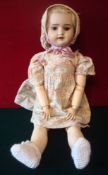 French Bisque Doll by SFBJ Paris: Jointed doll with Glass eyes having open mouth showing teeth still