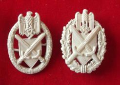 WW2 German Badges: Made from case zinc and having cross Swords beneath a German Eagle within a