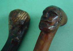 Two Carved Walking Sticks: To include hard wood knobbed walking stick having high quality carved