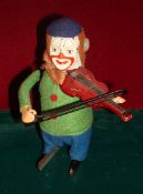 Schuco clockwork Clown with Violin: Green felt jacket, check trousers, red violin, with red
