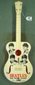 Selcol " Beatles" New Sound Guitar: Plastic, four strung, Orange body with cream front with