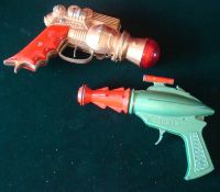 2 Space cap Guns: To consist of Lone Star " Stingray" metal gun, finished in green and red,