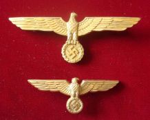 WW2 German Cap Eagles: Two Gold Gilt Medal Eagles with Swastika below both complete with fittings