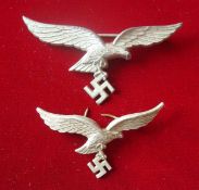 WW2 German Luftwaffe Badges: Two White Metal Luftwaffe Eagle Badges 1 been solid with pin back