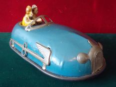 An Unusual 1950s Clockwork Powered Bumper Car: 9in Long, heavy tinplate blue painted body, black