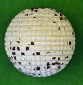 Unnamed line mesh guttie golf ball – retaining most of the original white finish - area to one